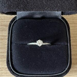 Platinum w/ diamond Tiffany & Co classic and timeless engagement ring